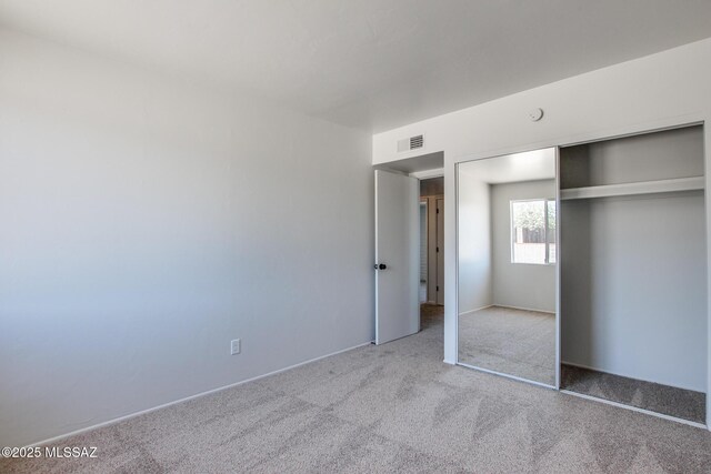 9570 E Sellarole Rd, Tucson, AZ 85730 - unfurnished bedroom with carpet floors and a closet