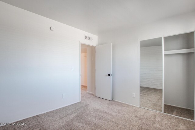 9570 E Sellarole Rd, Tucson, AZ 85730 - unfurnished bedroom featuring carpet and a closet