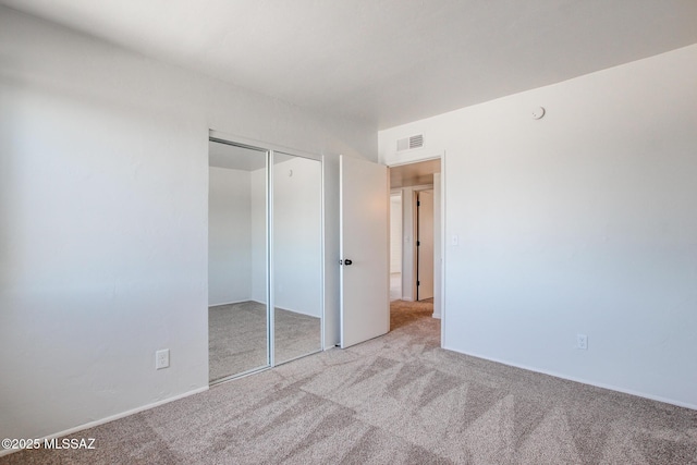 9570 E Sellarole Rd, Tucson, AZ 85730 - unfurnished bedroom featuring carpet flooring and a closet