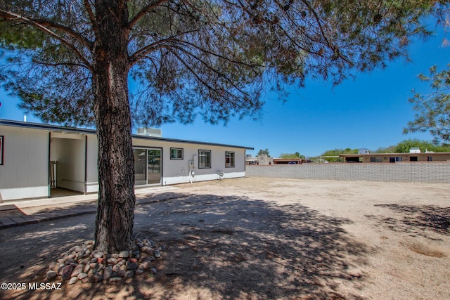 9570 E Sellarole Rd, Tucson, AZ 85730 - rear view of house with fence