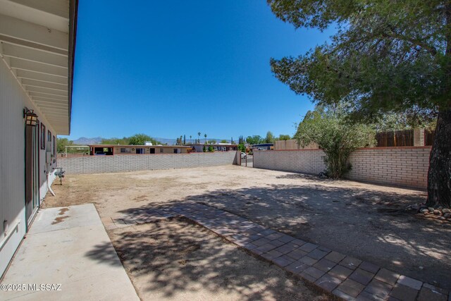 9570 E Sellarole Rd, Tucson, AZ 85730 - view of yard featuring fence