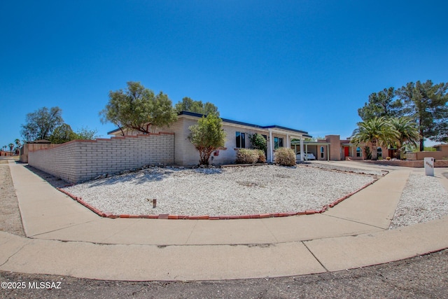 9570 E Sellarole Rd, Tucson, AZ 85730 - view of front facade featuring a garage and fence