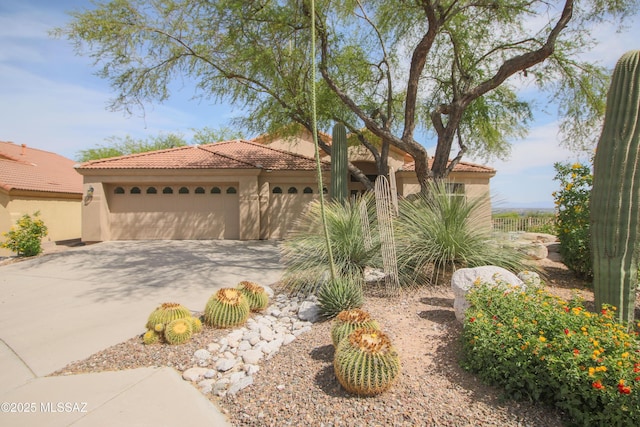 4416 N Saddle View Dr, Tucson, AZ 85750 - mediterranean / spanish home with a tile roof, driveway, a garage, and stucco siding