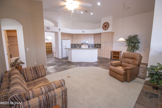 4416 N Saddle View Dr, Tucson, AZ 85750 - living area with ceiling fan, high vaulted ceiling, and arched walkways