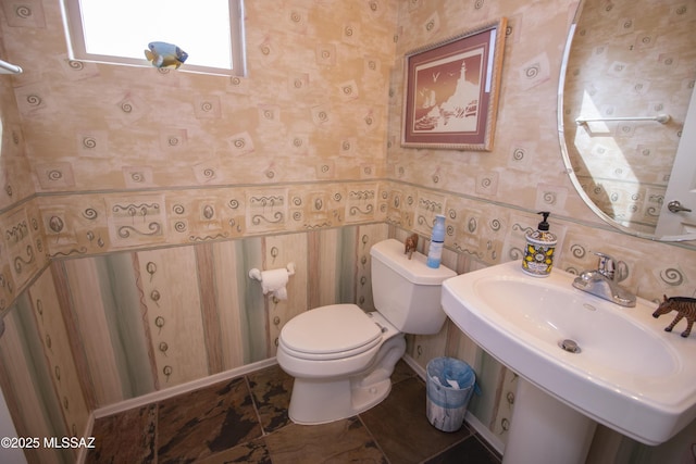 4416 N Saddle View Dr, Tucson, AZ 85750 - bathroom with wallpapered walls, toilet, and a sink