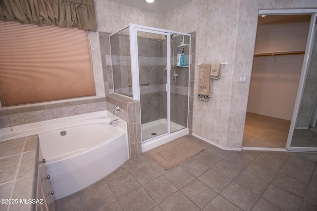 4416 N Saddle View Dr, Tucson, AZ 85750 - bathroom with a bath, a shower stall, a spacious closet, tile patterned floors, and baseboards