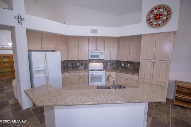 4416 N Saddle View Dr, Tucson, AZ 85750 - kitchen featuring white appliances, a sink, high vaulted ceiling, light stone counters, and decorative backsplash