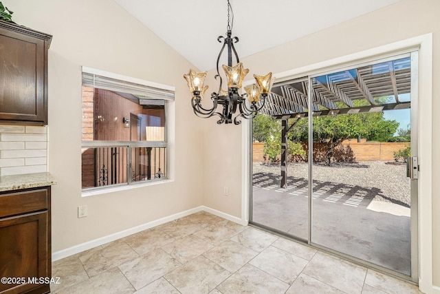 2742 S Via Del Bac, Green Valley, AZ 85622 - unfurnished dining area with a chandelier, baseboards, and lofted ceiling