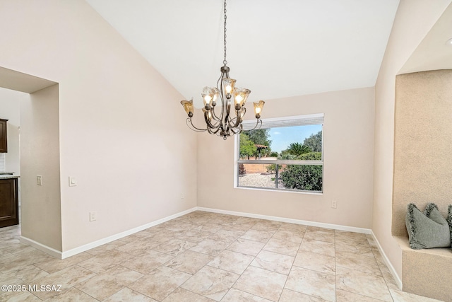 2742 S Via Del Bac, Green Valley, AZ 85622 - spare room featuring a chandelier, lofted ceiling, baseboards, and light marble finish flooring