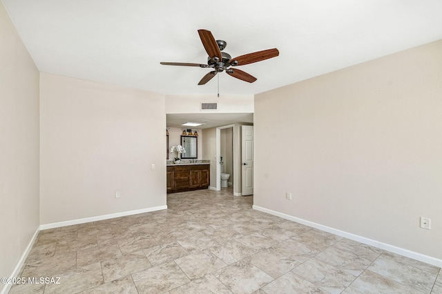 2742 S Via Del Bac, Green Valley, AZ 85622 - unfurnished living room with a ceiling fan and baseboards