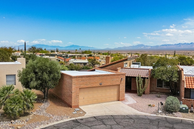 2742 S Via Del Bac, Green Valley, AZ 85622 - view of front of home with a mountain view, an attached garage, driveway, and a chimney