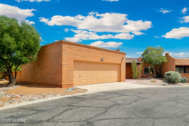 2742 S Via Del Bac, Green Valley, AZ 85622 - view of front facade with driveway and an attached garage