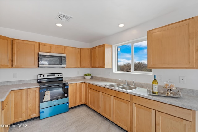 1846 Gardenias Ct, Rio Rico, AZ 85648 - kitchen featuring appliances with stainless steel finishes, a sink, light brown cabinetry, light countertops, and recessed lighting