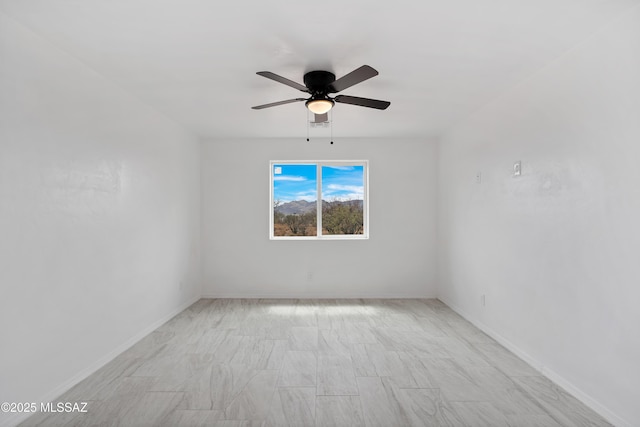1846 Gardenias Ct, Rio Rico, AZ 85648 - spare room featuring a ceiling fan and baseboards