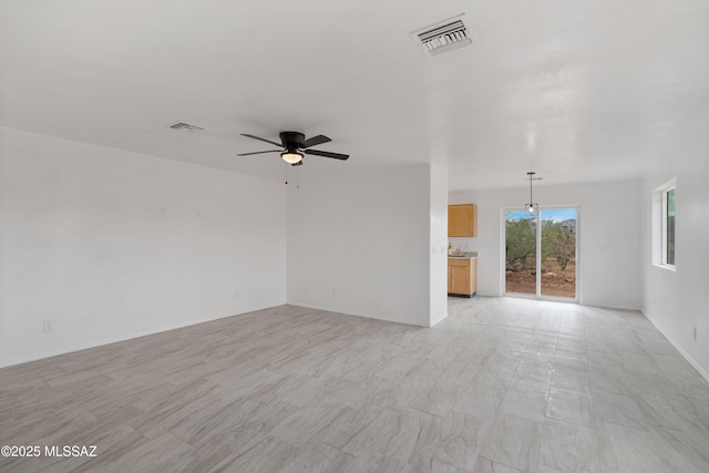 1846 Gardenias Ct, Rio Rico, AZ 85648 - unfurnished living room with ceiling fan and baseboards