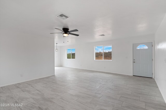 1846 Gardenias Ct, Rio Rico, AZ 85648 - spare room with a ceiling fan and baseboards