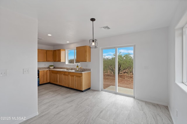 1846 Gardenias Ct, Rio Rico, AZ 85648 - kitchen with light countertops, decorative light fixtures, baseboards, and recessed lighting