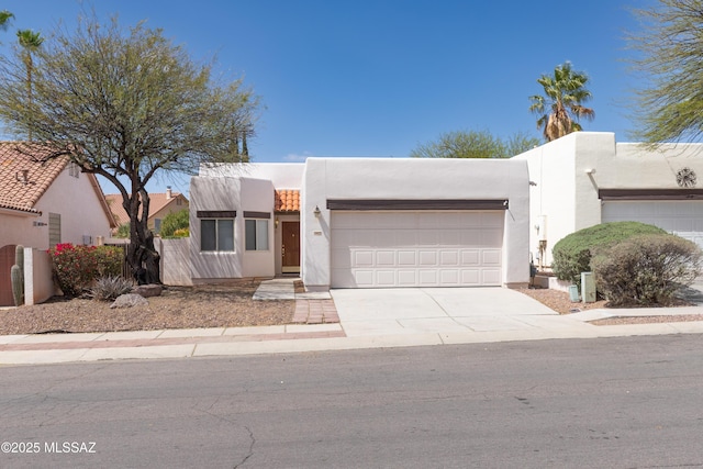 11629 N Copper Creek Dr, Oro Valley, AZ 85737 - adobe home featuring stucco siding, an attached garage, and driveway
