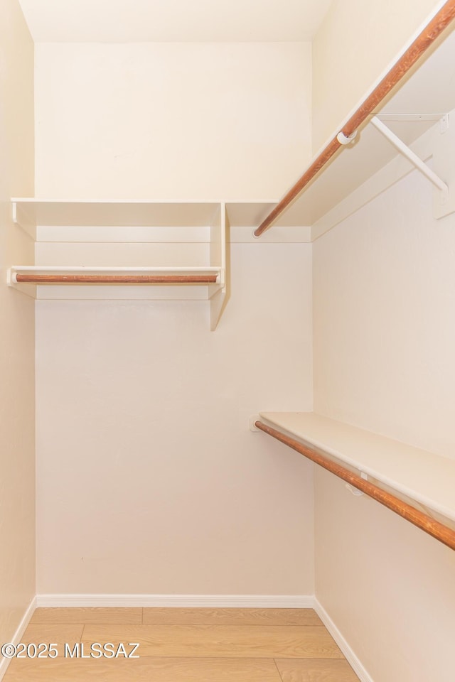 11629 N Copper Creek Dr, Oro Valley, AZ 85737 - walk in closet featuring light wood-type flooring