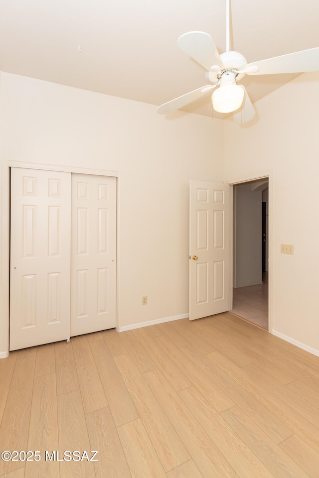 11629 N Copper Creek Dr, Oro Valley, AZ 85737 - unfurnished bedroom with light wood-style flooring, baseboards, and a closet