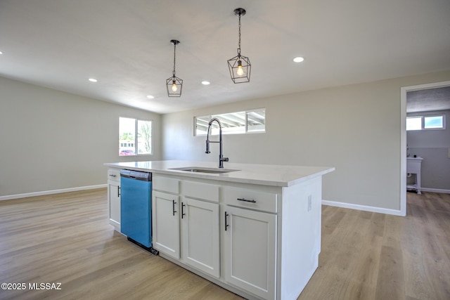 kitchen featuring a sink, dishwasher, healthy amount of natural light, recessed lighting, and light wood-style floors