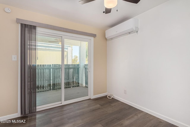 unfurnished room with an AC wall unit, a ceiling fan, dark wood finished floors, and baseboards