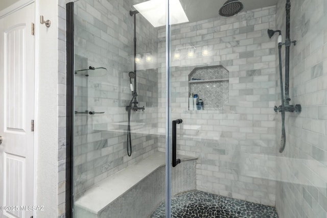 bathroom with a shower stall