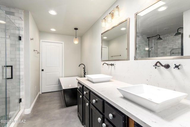 full bath featuring a shower stall, finished concrete flooring, recessed lighting, and baseboards