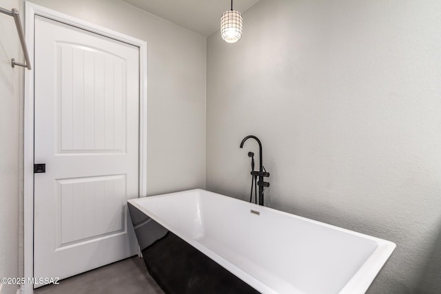 bathroom featuring a freestanding tub