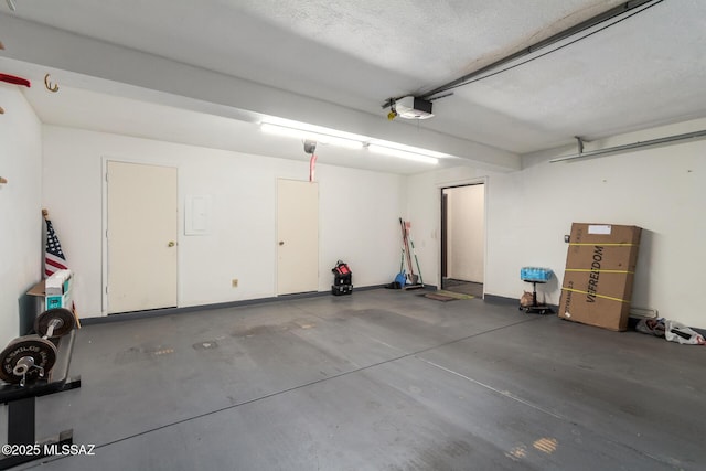 garage featuring a garage door opener