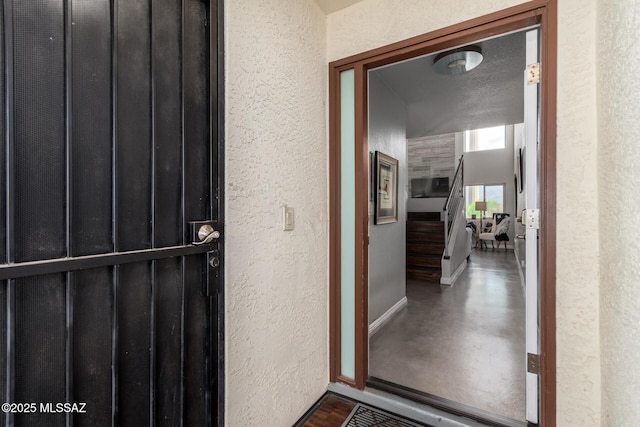 property entrance with stucco siding