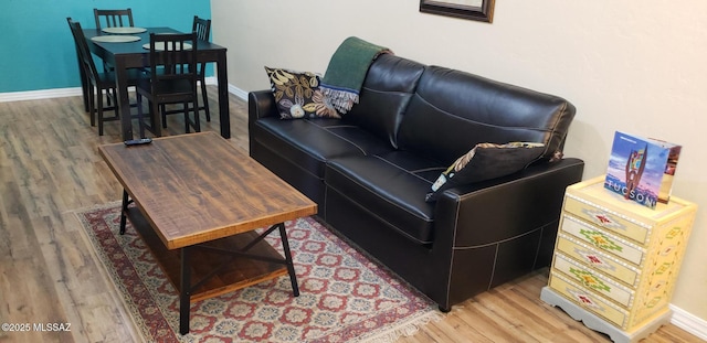 455 W Kelso St Apt 232, Tucson, AZ 85705 - living room featuring light wood-style floors and baseboards