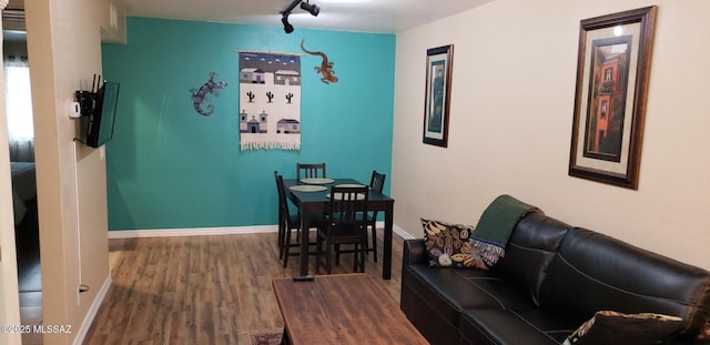 455 W Kelso St Apt 232, Tucson, AZ 85705 - dining room featuring wood finished floors, baseboards, and rail lighting