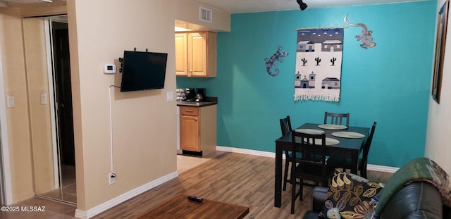 455 W Kelso St Apt 232, Tucson, AZ 85705 - dining area featuring wood finished floors and baseboards
