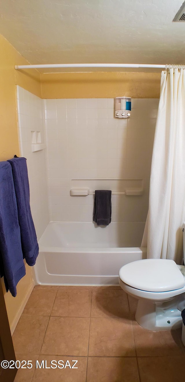 455 W Kelso St Apt 232, Tucson, AZ 85705 - bathroom featuring tile patterned flooring, toilet, shower / bathtub combination with curtain, and baseboards