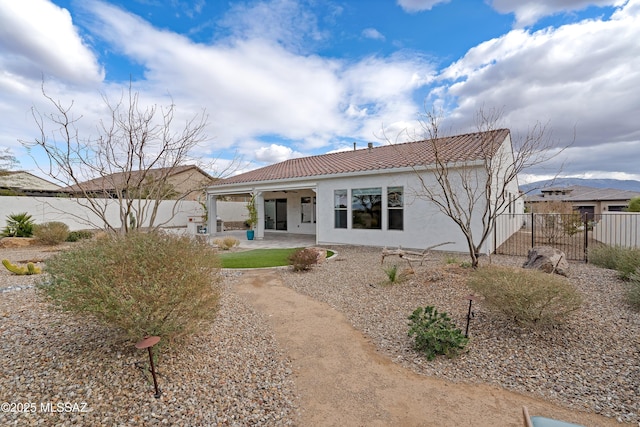31566 S Misty Basin Rd, Oracle, AZ 85623 - back of house with a tile roof, stucco siding, and a patio area