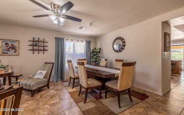 13570 E Hampden Green Way, Vail, AZ 85641 - dining room featuring a ceiling fan and a textured ceiling