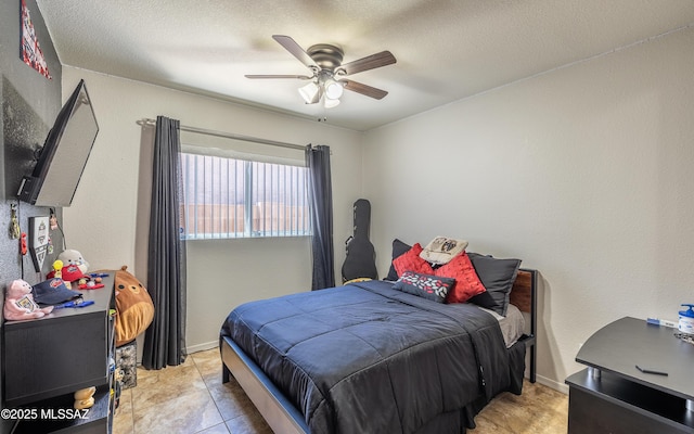 13570 E Hampden Green Way, Vail, AZ 85641 - bedroom featuring ceiling fan, a textured ceiling, and baseboards
