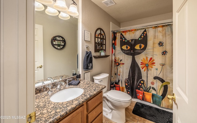 13570 E Hampden Green Way, Vail, AZ 85641 - bathroom with vanity, toilet, tile patterned floors, a textured wall, and a shower with curtain