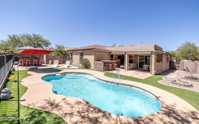 13570 E Hampden Green Way, Vail, AZ 85641 - view of swimming pool featuring a fenced backyard, a patio area, and a pool with connected hot tub
