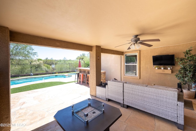 13570 E Hampden Green Way, Vail, AZ 85641 - fenced backyard with a patio area, ceiling fan, and an outdoor living space with a fire pit