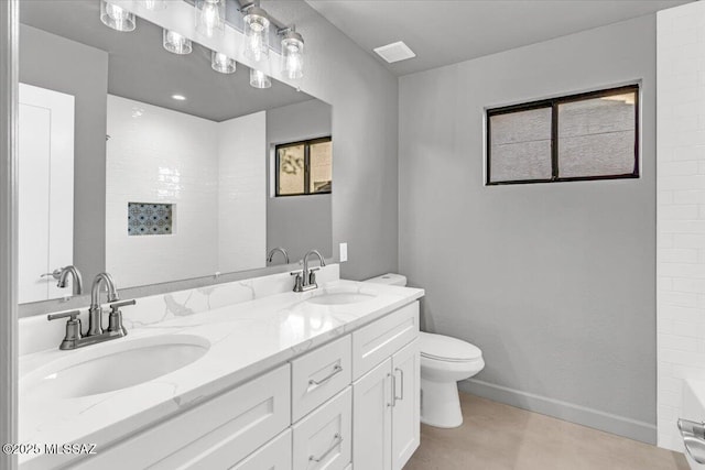 8046 S New Abbey Dr, Tucson, AZ 85747 - full bathroom with double vanity, toilet, a tub to relax in, a shower, and baseboards