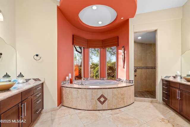 545 E Thunderstorm Pl, Oro Valley, AZ 85755 - bathroom with vanity, a garden tub, a tile shower, and recessed lighting