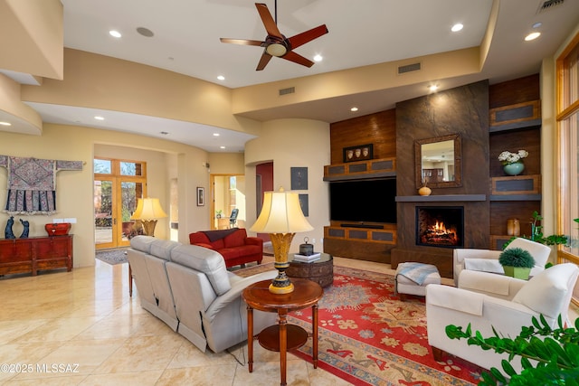 545 E Thunderstorm Pl, Oro Valley, AZ 85755 - living room featuring a ceiling fan, recessed lighting, and a fireplace
