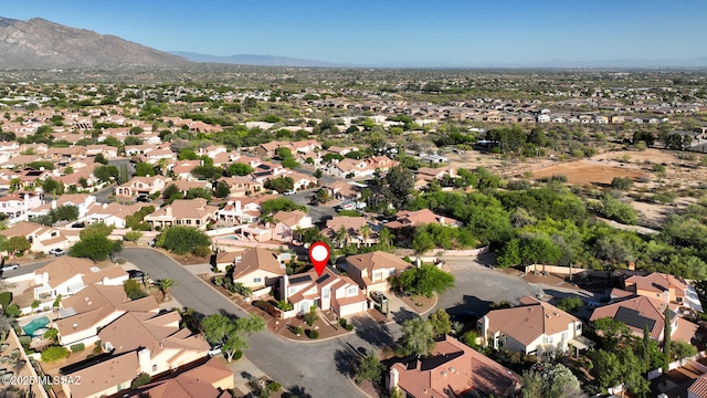 9870 N Meadow Flower Pl, Tucson, AZ 85742 - aerial overview of property's location featuring nearby suburban area and a mountain backdrop