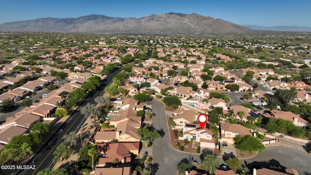 9870 N Meadow Flower Pl, Tucson, AZ 85742 - aerial overview of property's location featuring a mountain backdrop and nearby suburban area