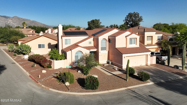 9870 N Meadow Flower Pl, Tucson, AZ 85742 - view of front facade with a tile roof, stucco siding, concrete driveway, a garage, and a residential view