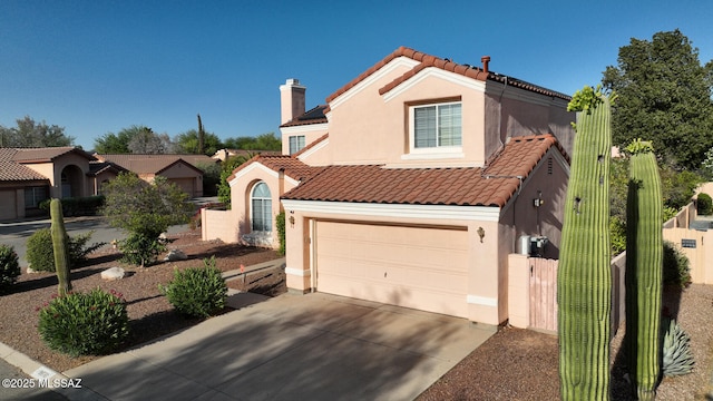 9870 N Meadow Flower Pl, Tucson, AZ 85742 - mediterranean / spanish home with a tiled roof, stucco siding, driveway, fence, and an attached garage
