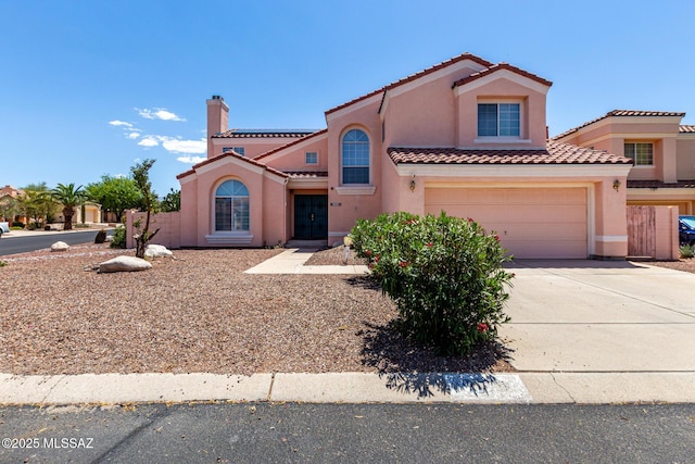 9870 N Meadow Flower Pl, Tucson, AZ 85742 - mediterranean / spanish home featuring stucco siding, a tile roof, a garage, driveway, and a chimney