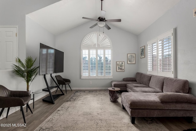 9870 N Meadow Flower Pl, Tucson, AZ 85742 - living area featuring wood finished floors, healthy amount of natural light, ceiling fan, vaulted ceiling, and baseboards